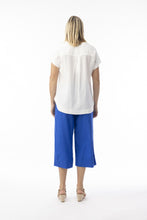 Load image into Gallery viewer, Orientique electric blue loose organic cotton and linen blend cropped trousers, showcasing relaxed fit and breathable fabric.