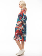 Load image into Gallery viewer, Orientique Apollo blue and red mixed cotton jersey 3/4 sleeve panel bubble dress shown from side view.