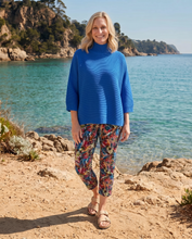 Load image into Gallery viewer, Foil Signature Fuss Free Printed Capri 7/8 Stretch Trousers, featuring a vibrant floral pattern and comfortable fit, shown on a model.