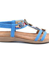 Load image into Gallery viewer, Lunar Feast blue open toe T-bar sandals with floral ribbon trim and elasticated back, stylish and comfortable for warm weather.
