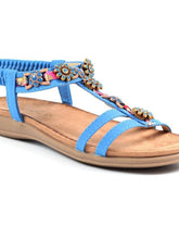 Load image into Gallery viewer, Lunar Feast open-toe T-bar sandals with floral ribbon trim and elasticated back in blue, stylish summer footwear.