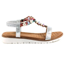 Load image into Gallery viewer, Lunar Tempo silver metallic plaited T-bar open toe sandals with jeweled accents and ankle strap, stylish and comfortable footwear.
