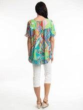 Load image into Gallery viewer, Orientique Zio Turq organic cotton woven top with frill trim and sleeve details, showcasing a stylish and comfortable design.