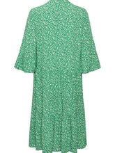 Load image into Gallery viewer, Saint Tropez Eda Jelly Bean Ditsy printed dress with fluted elbow sleeves and tiered design, in green, displayed on a hanger.