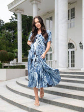 Load image into Gallery viewer, Orientique Agios blue palm print crinkle short sleeve midi dress with godet panels, flowing and lightweight fabric.