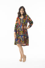 Load image into Gallery viewer, Orientique Torgua boho dress with V-neck, printed design, detailed trim, and tassel accents in crepe woven fabric.
