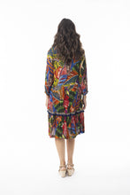 Load image into Gallery viewer, Orientique Torgua printed boho dress with V-neck, detailed trim, tassels, and crepe woven fabric, perfect for casual wear.
