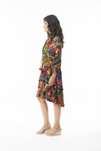 Load image into Gallery viewer, Orientique Torgua printed boho dress with V-neck, detailed trim, tassels, and crepe woven fabric, perfect for casual summer wear.
