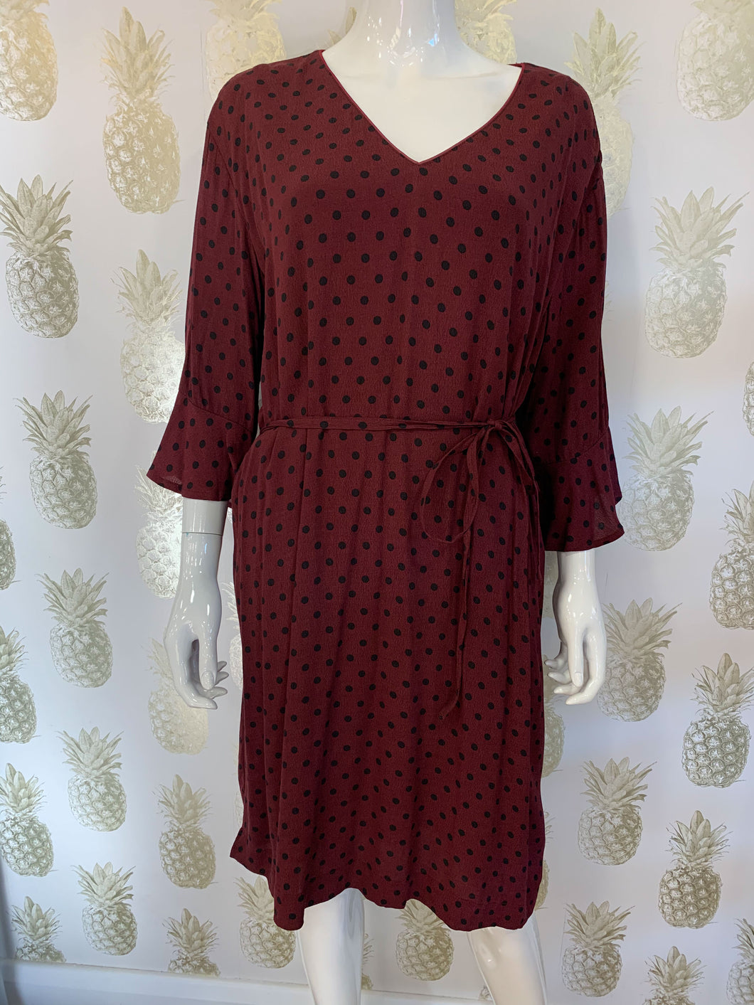 Burgundy & black polka dot woven v neck tunic dress with fluted 3/4 sleeve & tie waist. Sits above the knee - Boutique on the Green